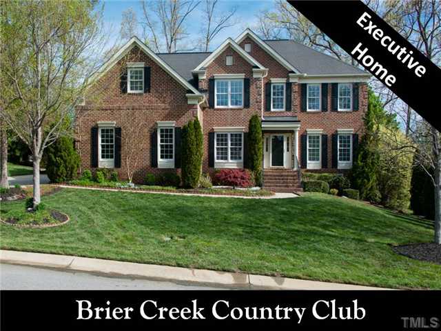 9216 Club Hill Drive Raleigh, NC 27617 - Photo 1 of 25 a front view of a house with a yard