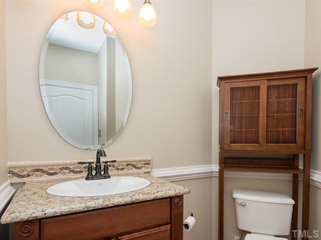 9216 Club Hill Drive Raleigh, NC 27617 - Photo 11 of 25 a bathroom with a granite countertop sink and a mirror