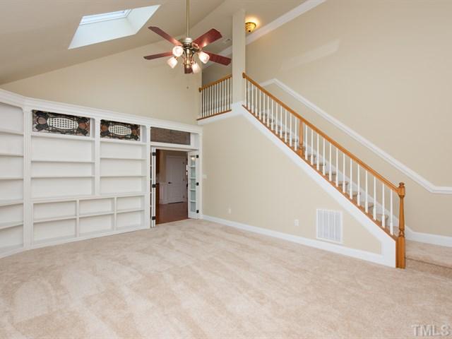 9216 Club Hill Drive Raleigh, NC 27617 - Photo 14 of 25 a view of an empty room with a ceiling fan