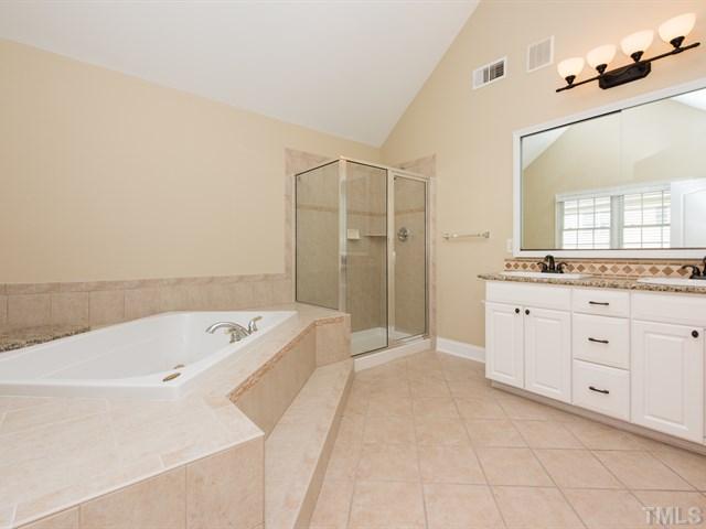 9216 Club Hill Drive Raleigh, NC 27617 - Photo 17 of 25 a spacious bathroom with a tub sink and mirror