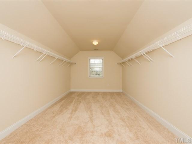 9216 Club Hill Drive Raleigh, NC 27617 - Photo 18 of 25 an empty room with windows and exposed radiator