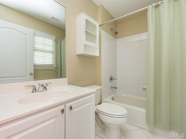 9216 Club Hill Drive Raleigh, NC 27617 - Photo 19 of 25 a bathroom with a sink a toilet and shower