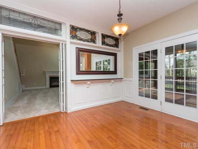 9216 Club Hill Drive Raleigh, NC 27617 - Photo 7 of 25 a view of empty room with wooden floor and fan