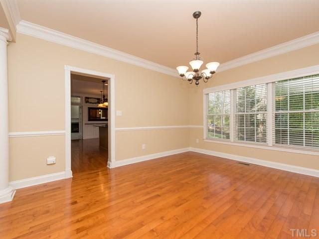 9216 Club Hill Drive Raleigh, NC 27617 - Photo 9 of 25 a view of an empty room with a window and kitchen view