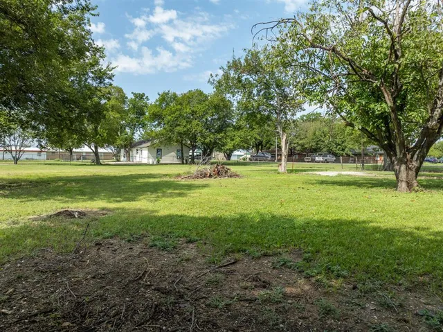a view of a lake view with large trees