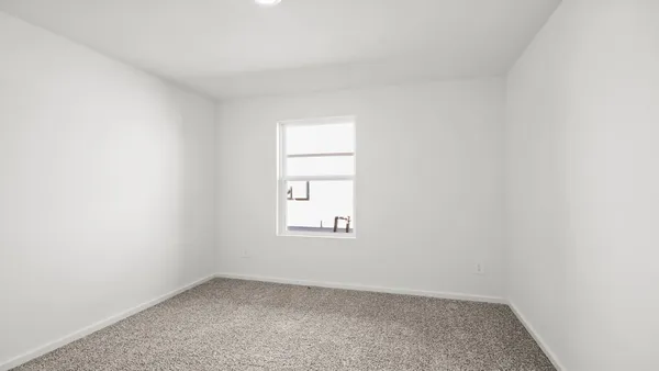 an empty room with a window