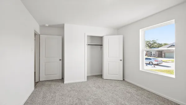 a house that has a big yard in front of it