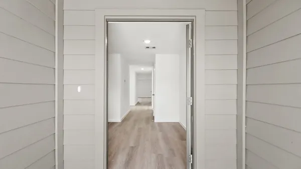 a view of a bathroom from a hallway