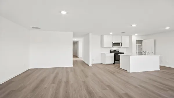 a view of kitchen with wooden floor