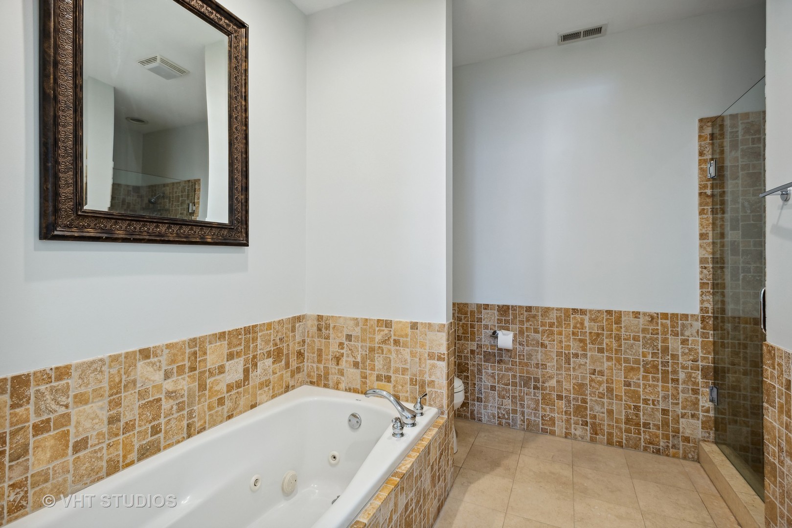 523 North Racine Avenue, Unit 4 Chicago, IL 60642 - Photo 12 of 17 a bathroom with a bathtub and shower