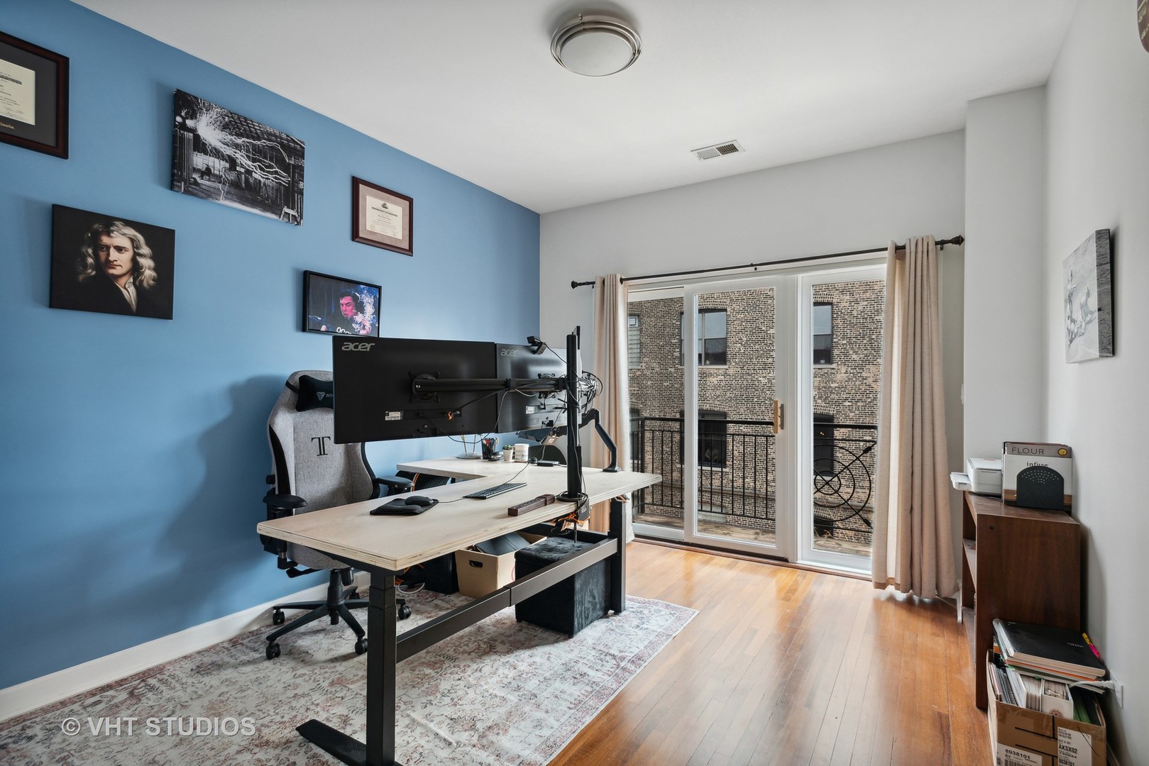 523 North Racine Avenue, Unit 4 Chicago, IL 60642 - Photo 13 of 17 a living room with furniture and a flat screen tv