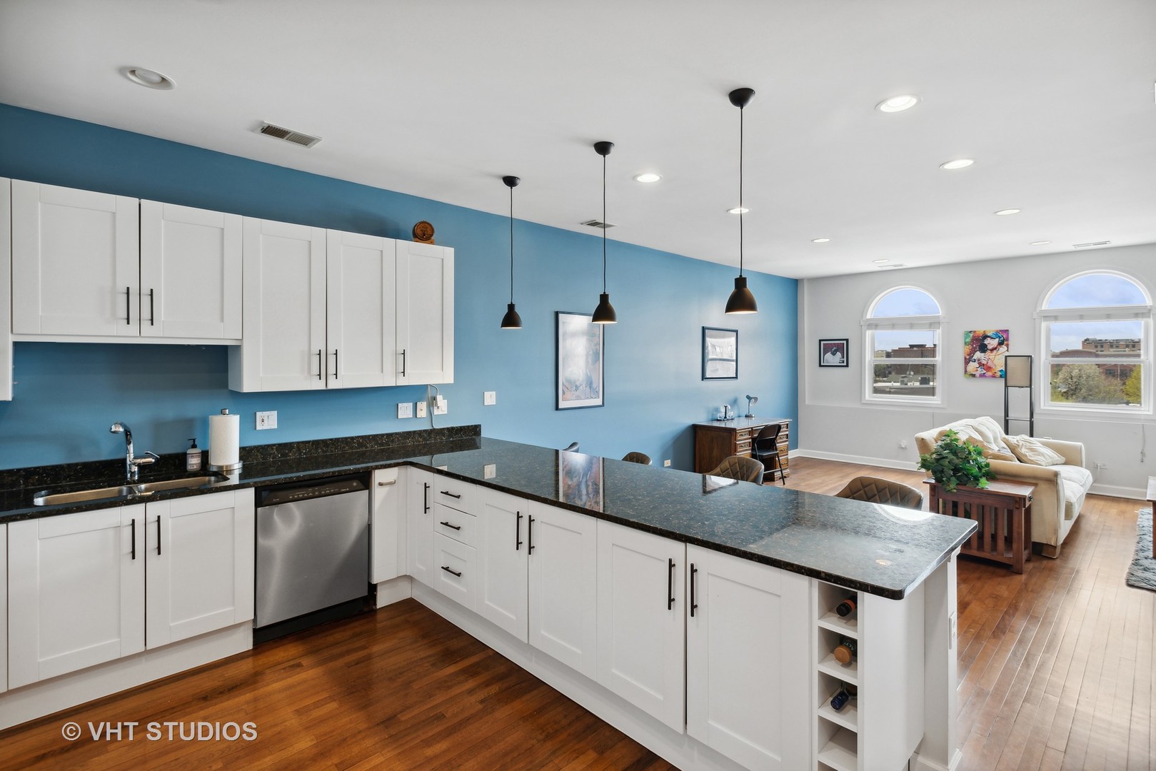 523 North Racine Avenue, Unit 4 Chicago, IL 60642 - Photo 6 of 17 a kitchen with granite countertop a sink cabinets and wooden floor