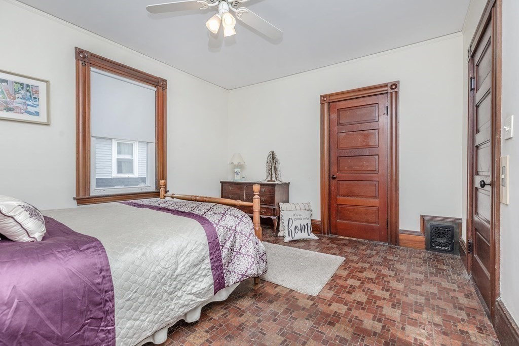 28 Andover Street Peabody, MA 01960 - Photo 17 of 30 a bedroom with a bed dresser and a window