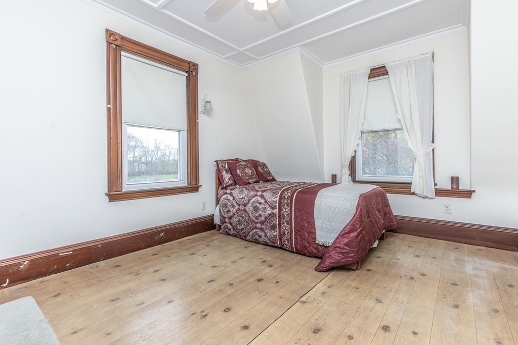 28 Andover Street Peabody, MA 01960 - Photo 19 of 30 a bedroom with a bed and a window
