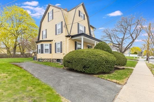 28 Andover Street Peabody, MA 01960 - Photo 2 of 30 a view of a house with a backyard