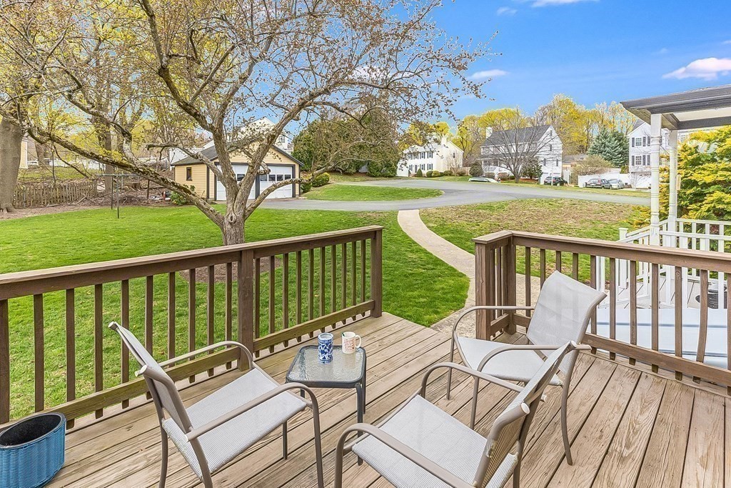 28 Andover Street Peabody, MA 01960 - Photo 28 of 30 a view of a patio with chairs and floor to ceiling window