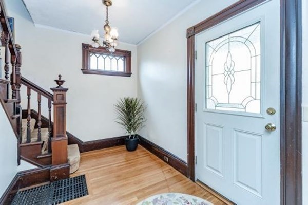 28 Andover Street Peabody, MA 01960 - Photo 7 of 30 a view of an empty room with wooden floor and a window