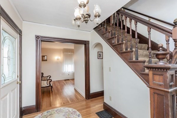 28 Andover Street Peabody, MA 01960 - Photo 8 of 30 a view of a livingroom with wooden floor and stairs