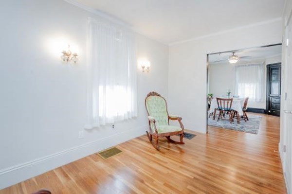 28 Andover Street Peabody, MA 01960 - Photo 10 of 30 a living room with furniture and a wooden floor