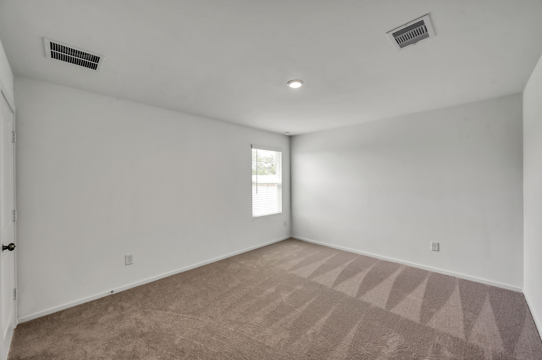 29635 Knollwood Bay Road Waller, TX 77484 - Photo 22 of 39 a view of an empty room and window