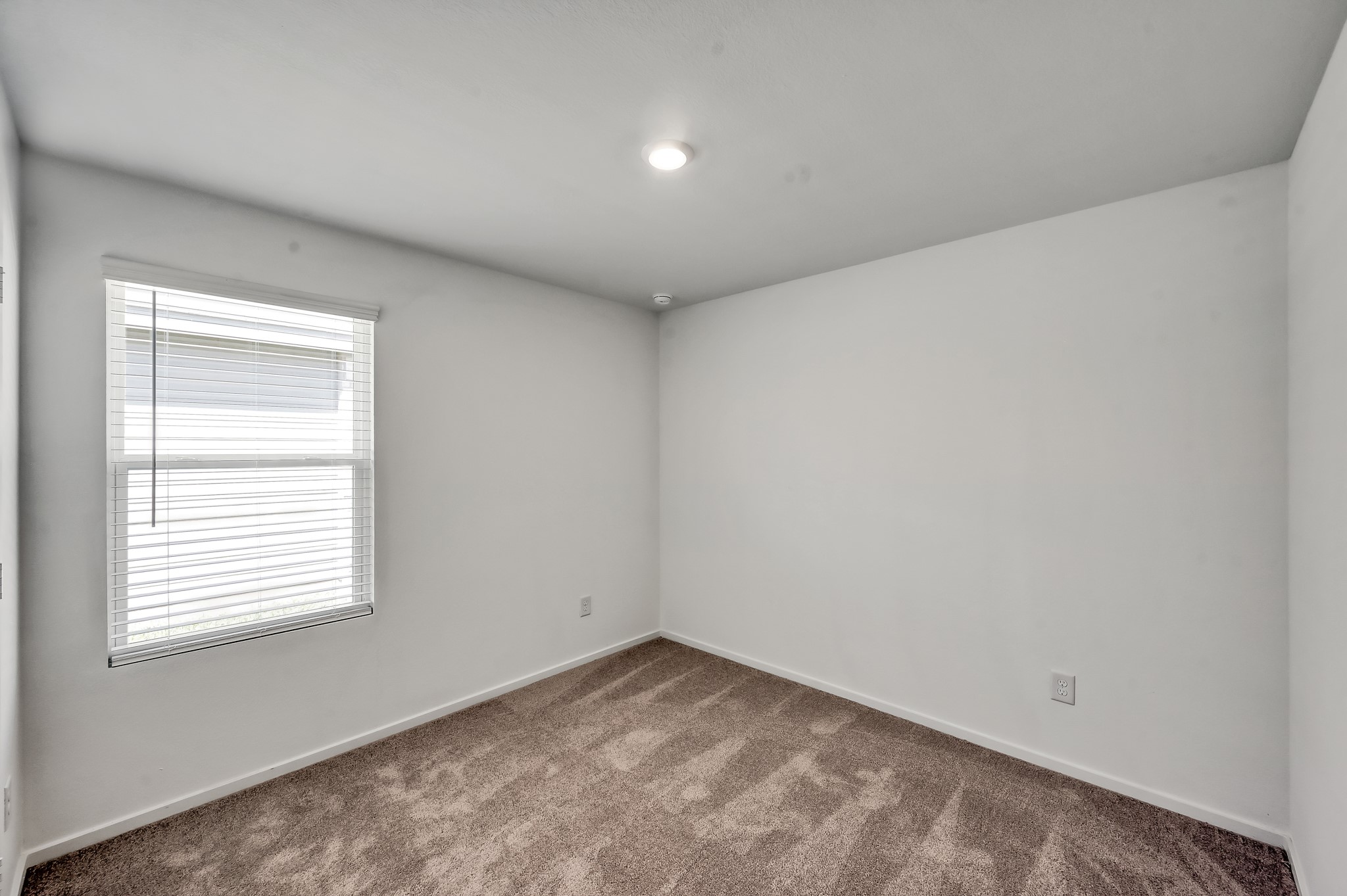 29635 Knollwood Bay Road Waller, TX 77484 - Photo 32 of 39 an empty room with a window