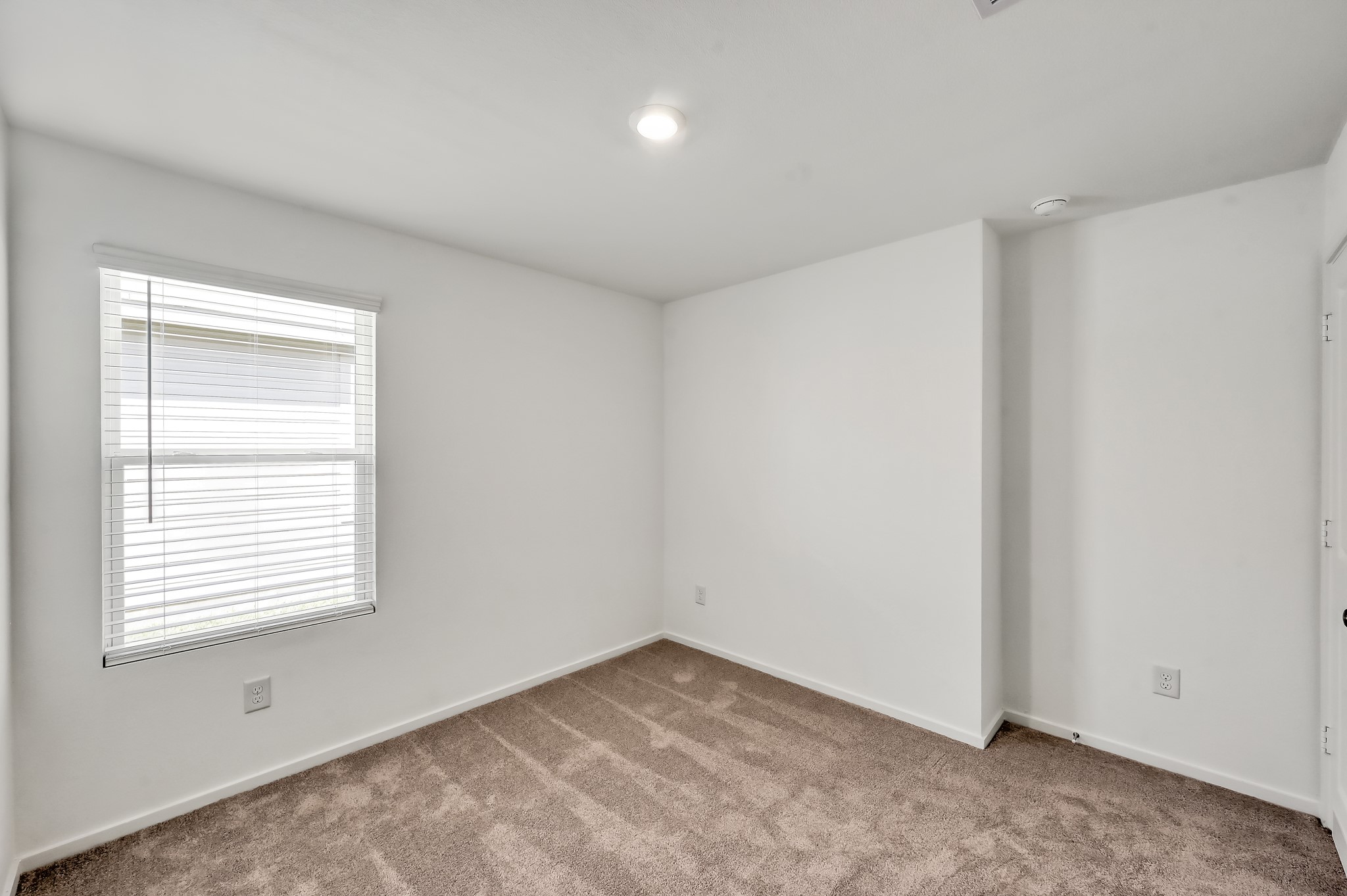 29635 Knollwood Bay Road Waller, TX 77484 - Photo 36 of 39 a view of an empty room with a window
