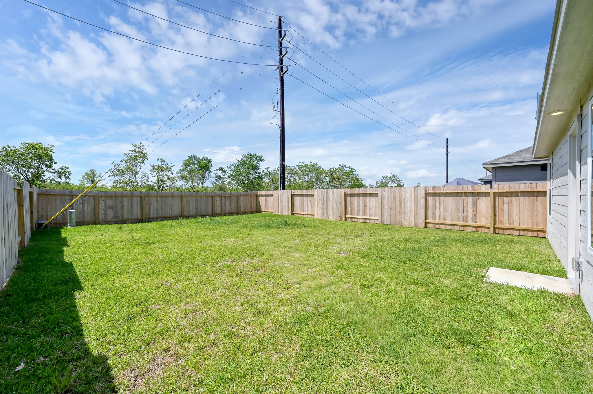 29635 Knollwood Bay Road Waller, TX 77484 - Photo 37 of 39 a view of a backyard with grass & a fence