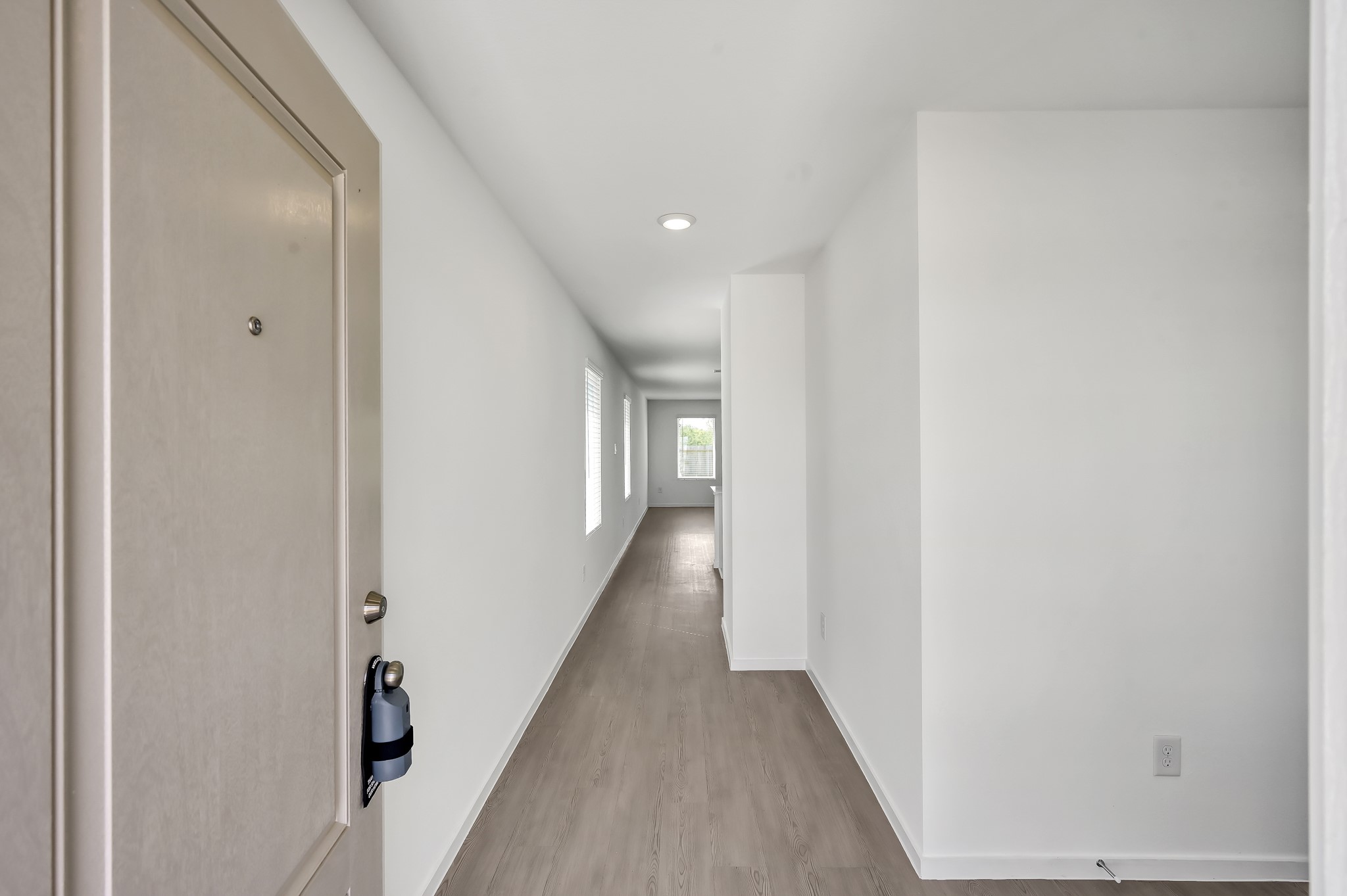 29635 Knollwood Bay Road Waller, TX 77484 - Photo 5 of 39 a view of a hallway with wooden floor