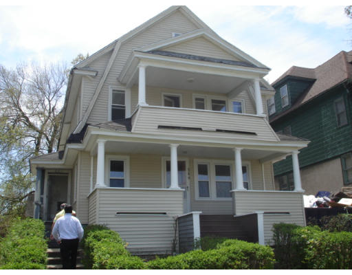 549-551 Wilbraham Road Springfield, MA 01109 - Photo 1 of 2 a front view of a house with a yard