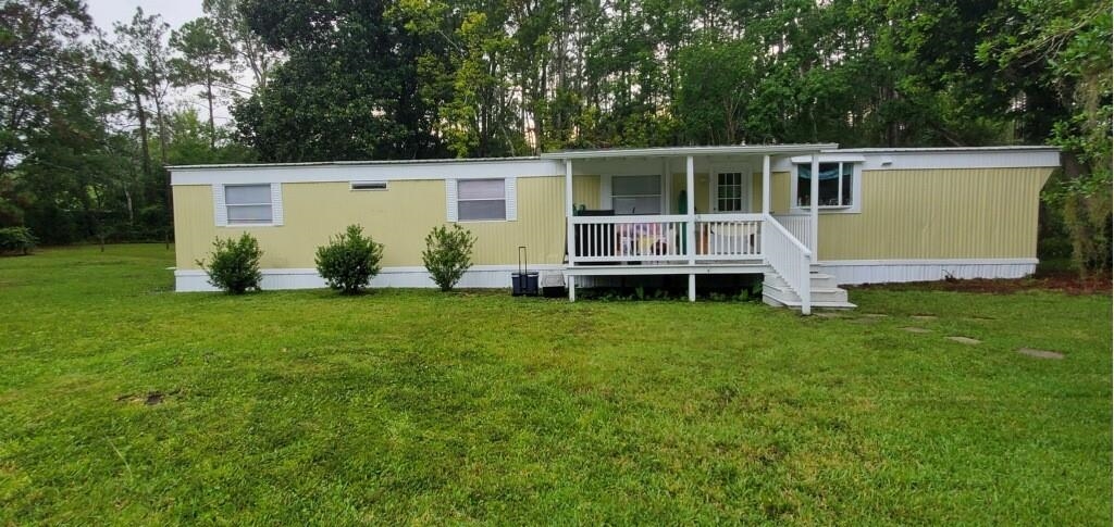 a front view of house with yard and seating area