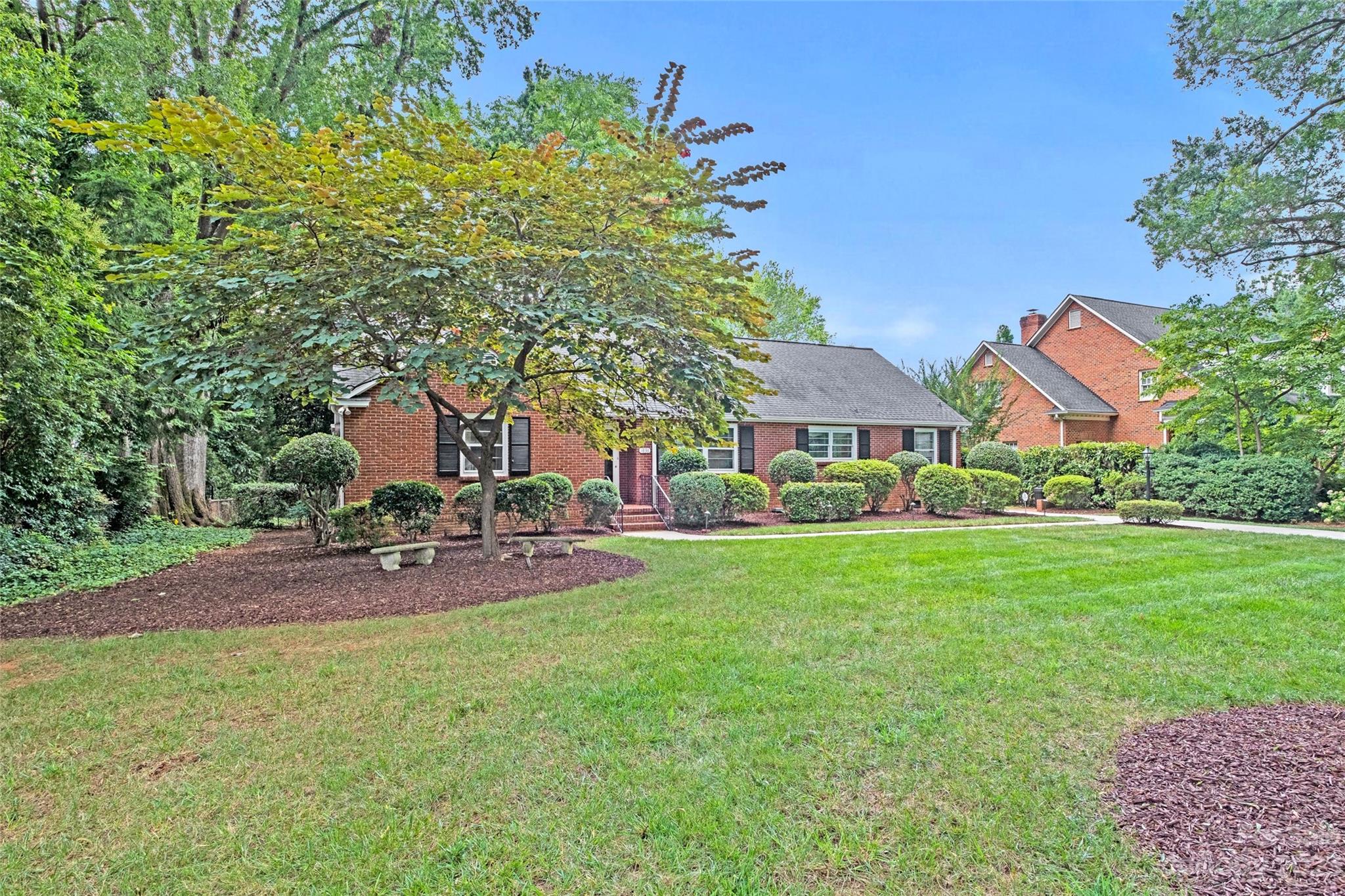 1836 Harris Road Charlotte, NC 28211 - Photo 6 of 33 a patio with table and chairs and potted plants