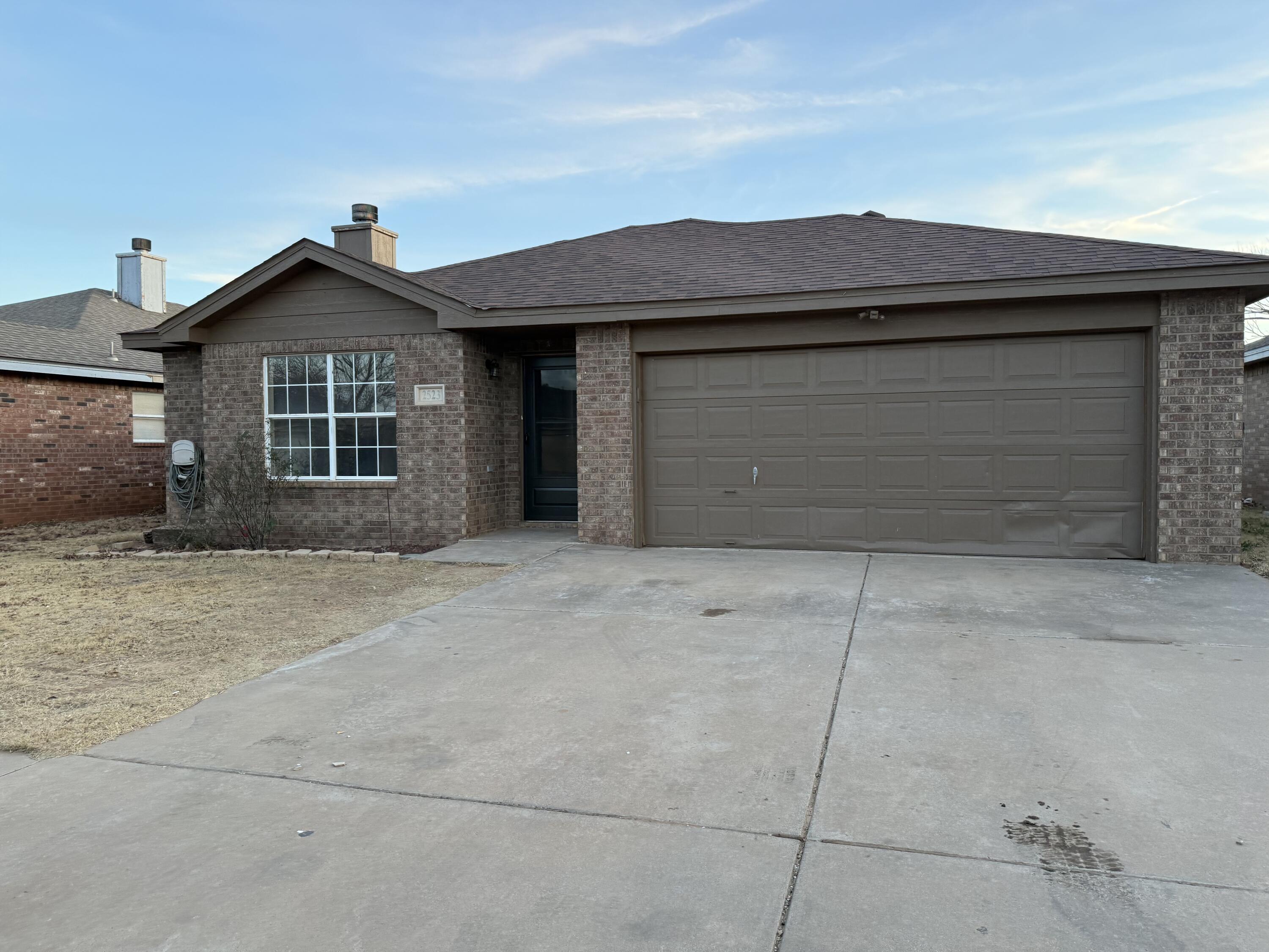 2523 110th Street Lubbock, TX 79423 - Photo 1 of 23 a house view with a outdoor space