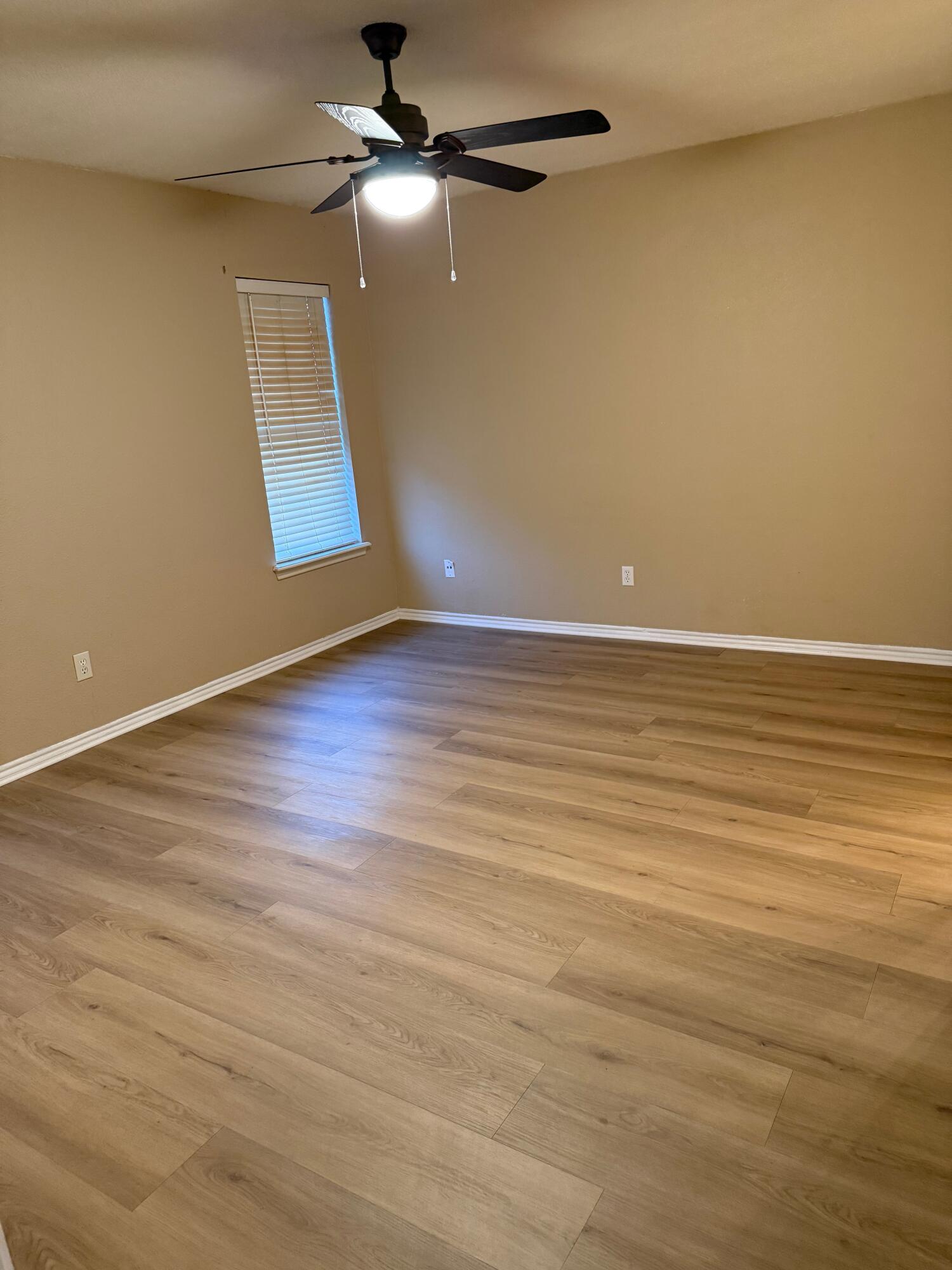 2523 110th Street Lubbock, TX 79423 - Photo 18 of 23 wooden floor in an empty room