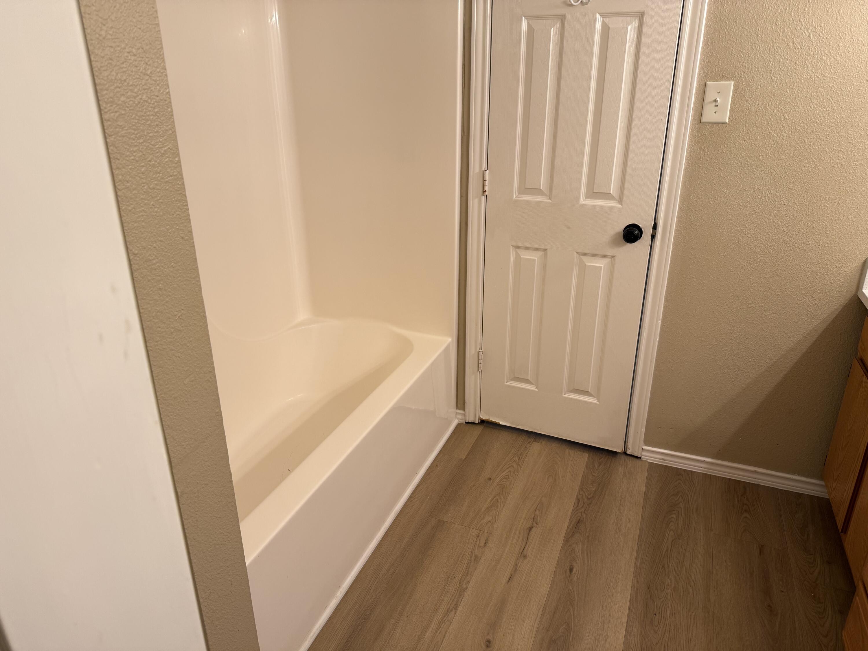 2523 110th Street Lubbock, TX 79423 - Photo 23 of 23 a view of bathroom with bathtub and shower