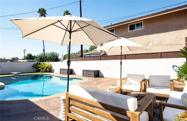 a view of a swimming pool with a lounge chairs