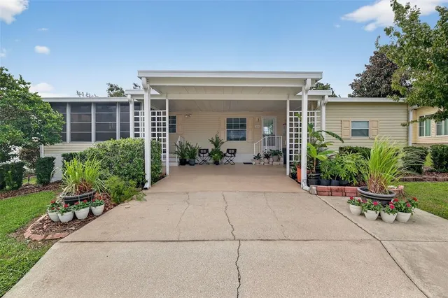 front view of a house with a bench