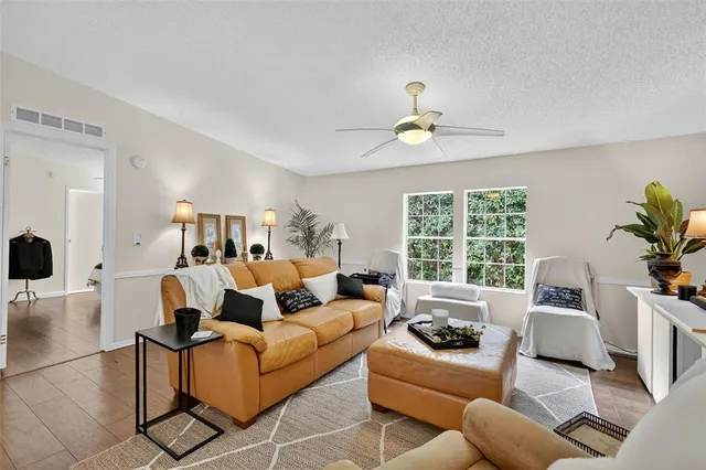 a living room with furniture and a large window