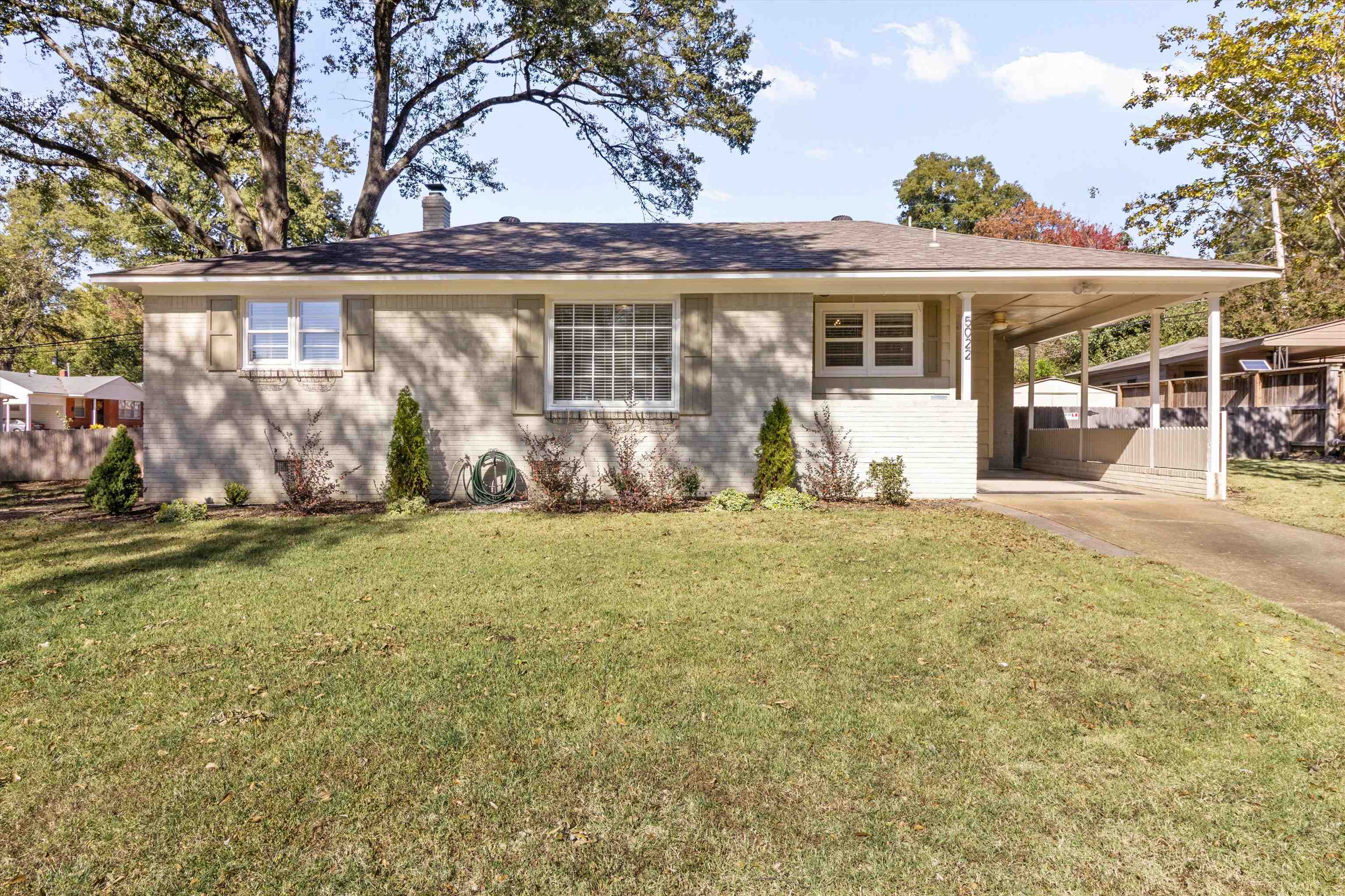 5022 Sea Isle Road Memphis, TN 38117 - Photo 1 of 28 a front view of a house with garden