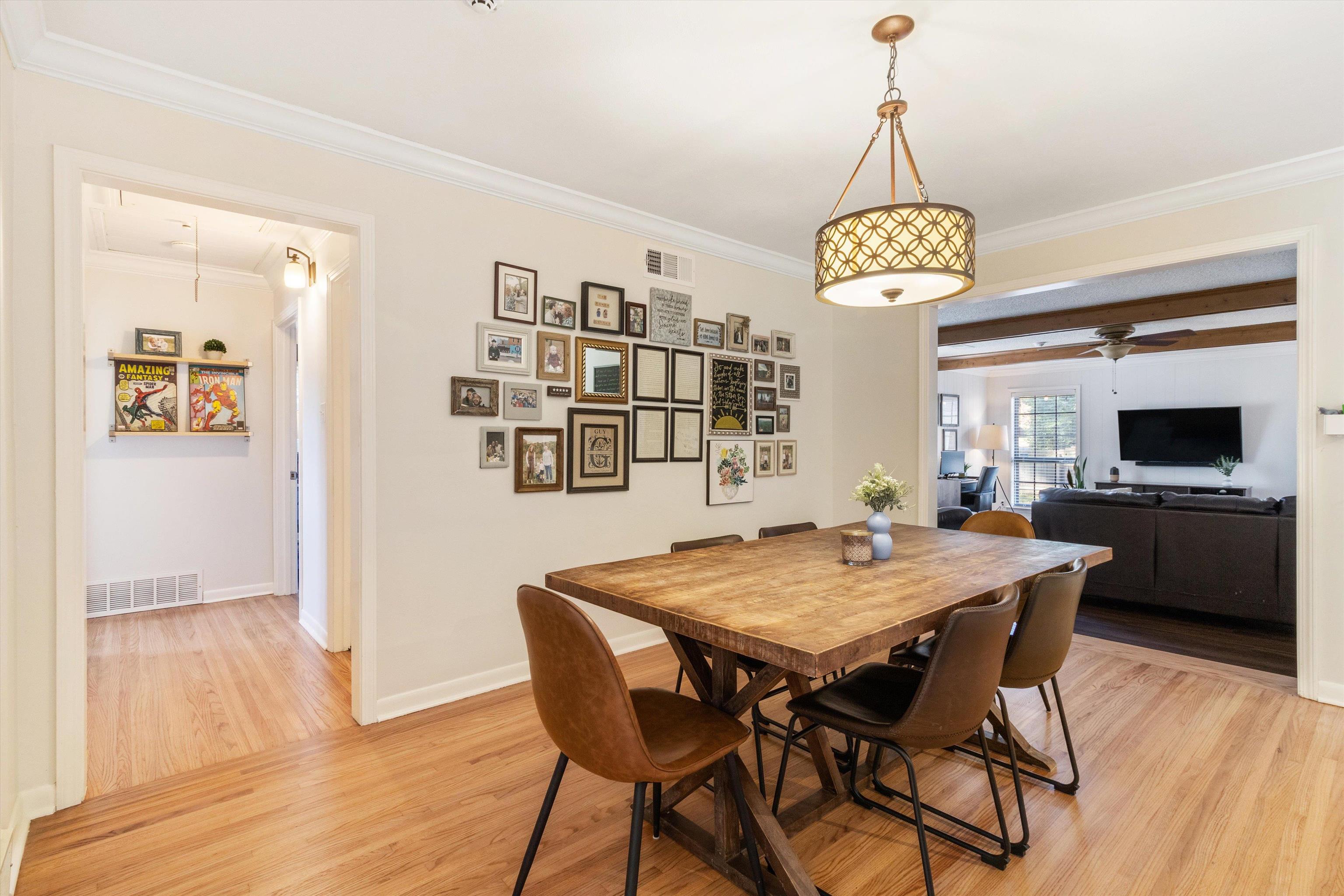 5022 Sea Isle Road Memphis, TN 38117 - Photo 12 of 28 a view of a dining room with furniture window and wooden floor