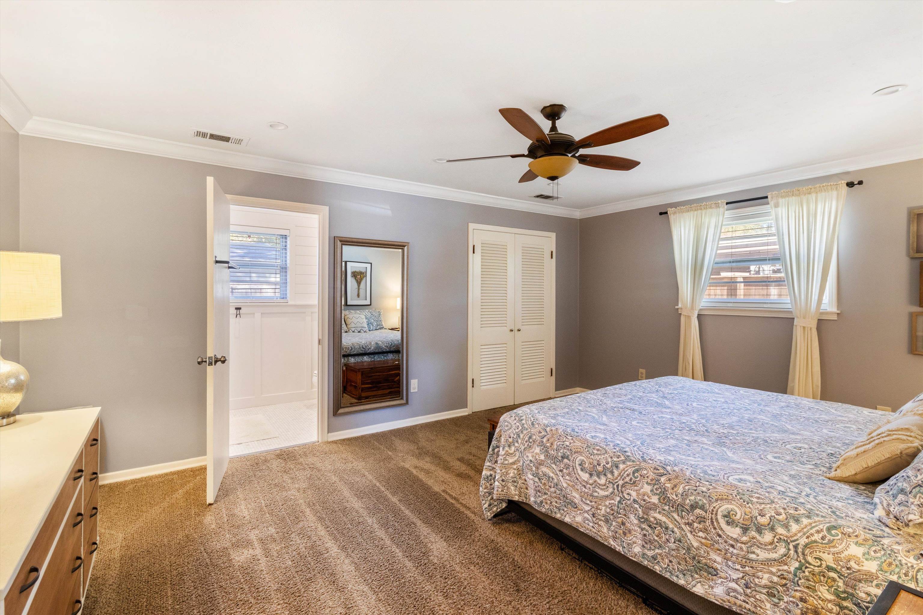5022 Sea Isle Road Memphis, TN 38117 - Photo 17 of 28 a bedroom with a bed and a chandelier