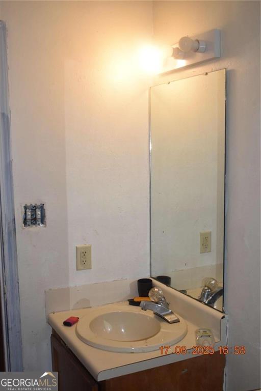 4433 Azalea Drive Macon, GA 31210 - Photo 16 of 24 a bathroom with a sink and a mirror