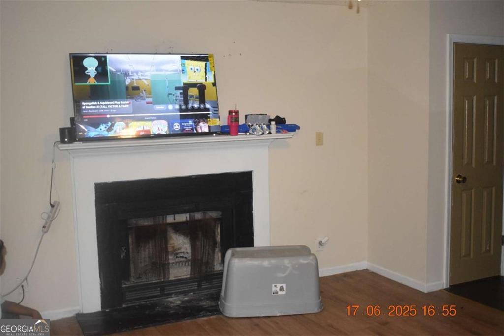 4433 Azalea Drive Macon, GA 31210 - Photo 2 of 24 a living room with furniture and a fireplace