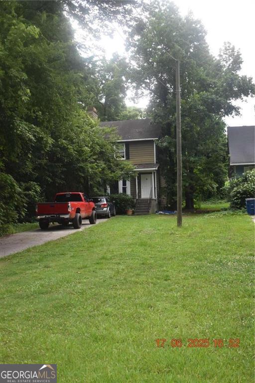 4433 Azalea Drive Macon, GA 31210 - Photo 24 of 24 a front view of a house with a garden