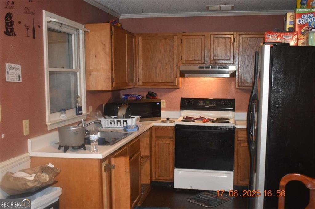 4433 Azalea Drive Macon, GA 31210 - Photo 5 of 24 a kitchen with stainless steel appliances granite countertop a stove a refrigerator and a sink