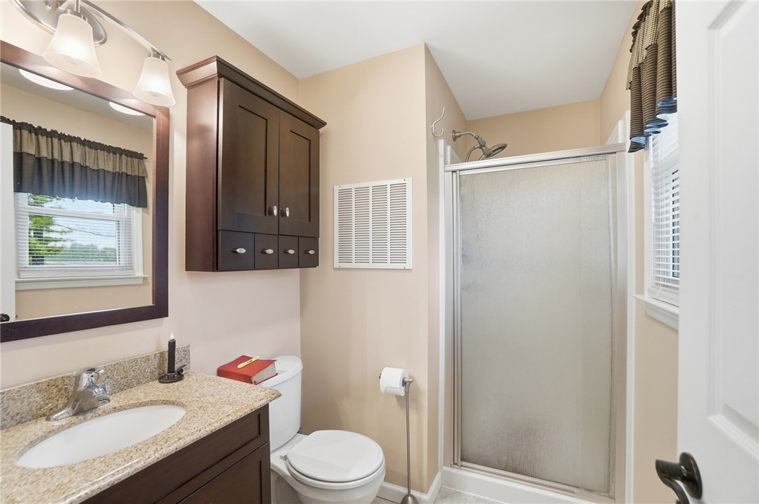 4170 Johnson Road Springfield, OH 45502 - Photo 38 of 54 Functional full bathroom featuring a stand-up shower and a granite-topped vanity.