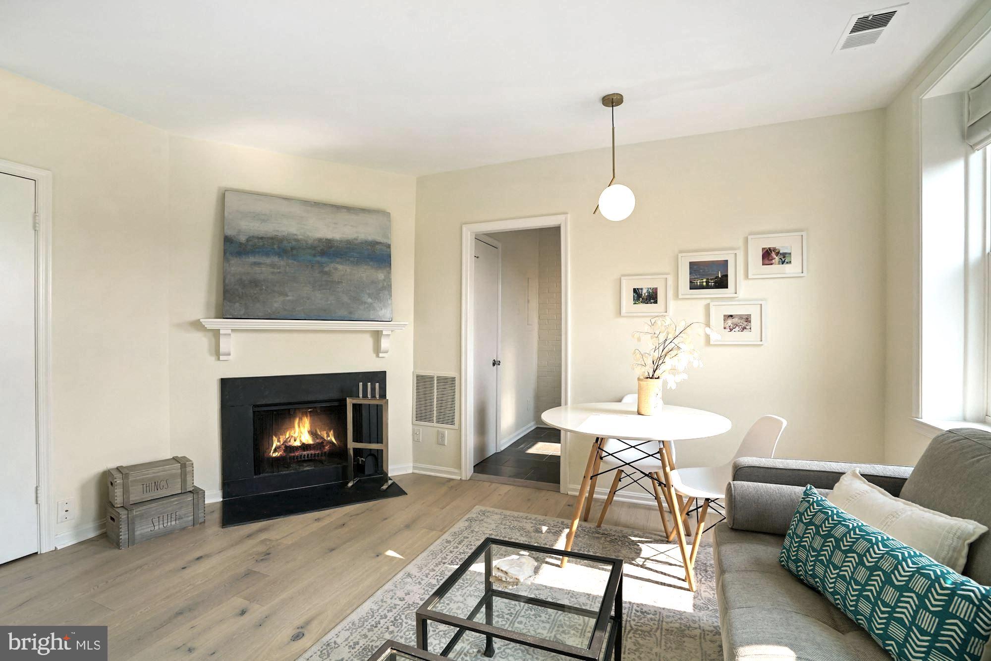 2001 16th Street Northwest, Unit 407 Washington, DC 20009 - Photo 2 of 14 Sun Drenched Living Room w/ Fireplace