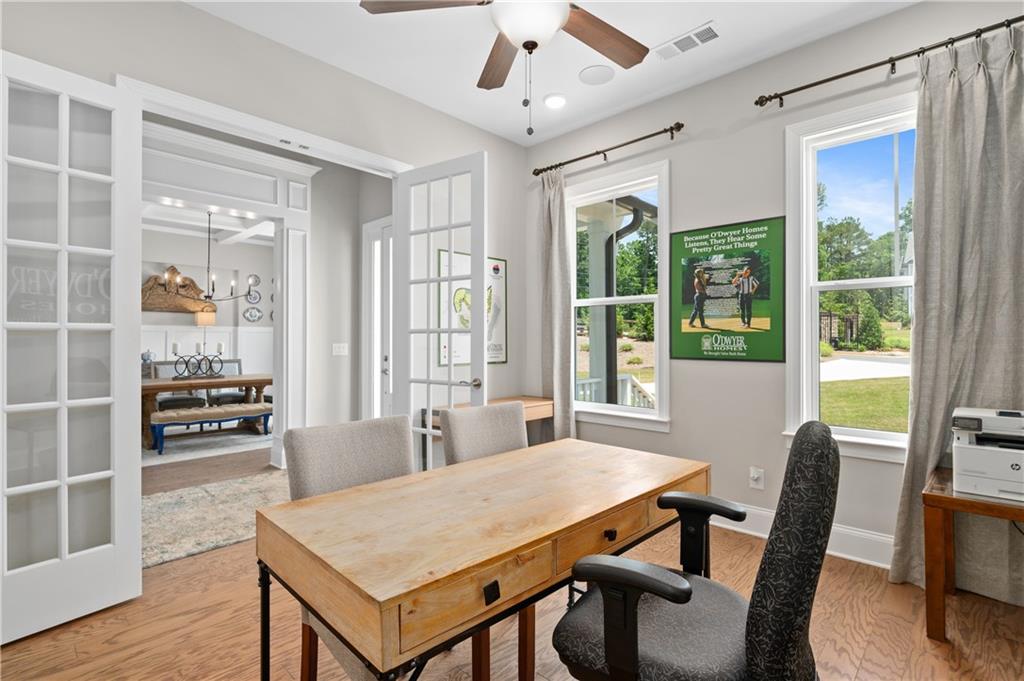 3710 Reserve Overlook Way Cumming, GA 30041 - Photo 12 of 98 a view of a dining room with furniture window and wooden floor