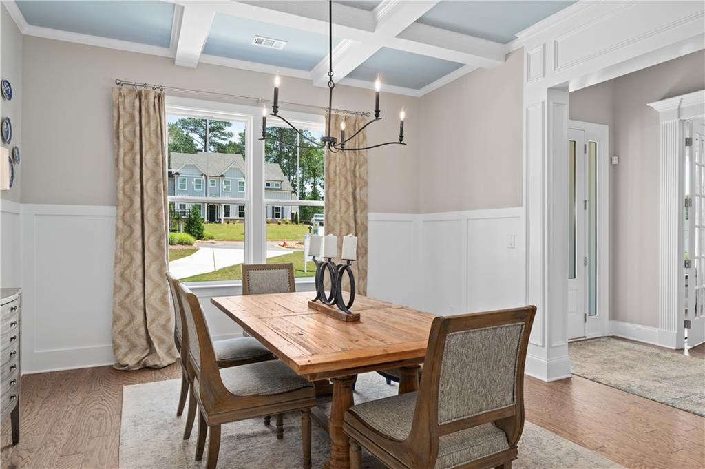 3710 Reserve Overlook Way Cumming, GA 30041 - Photo 16 of 98 a view of a dining room with furniture window and wooden floor