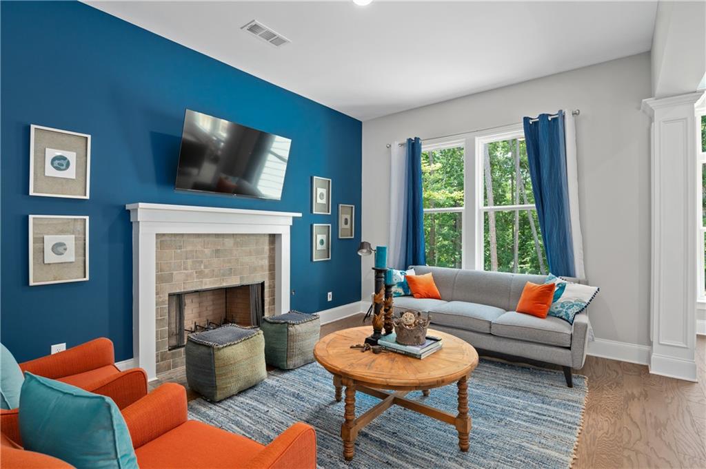 3710 Reserve Overlook Way Cumming, GA 30041 - Photo 19 of 98 a living room with furniture and a fireplace