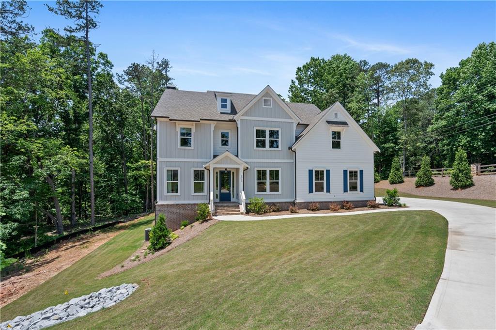 3710 Reserve Overlook Way Cumming, GA 30041 - Photo 2 of 98 a front view of a house with a yard